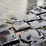 Cobblestone brick paved street in Rome